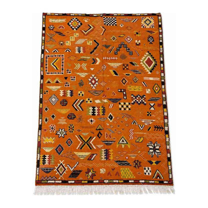 Tapis Akhnif orange terracotta à symboles berbères