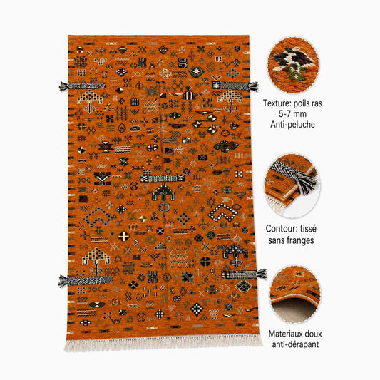Tapis Akhnif orange rouille à symboles berbères et pompons