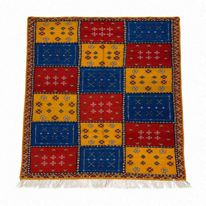 Tapis Akhnif patchwork rouge, bleu et ocre à motifs berbères